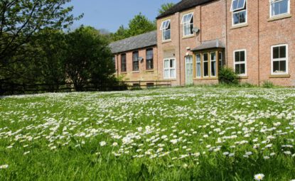 large grass garden area in front of Cote Ghyll Mill