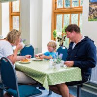 family eating breakfast in dining room