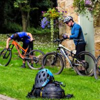 cyclists preparing their bikes at Cote Ghyll MIll