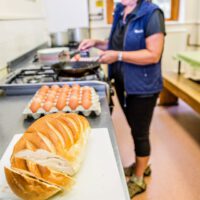 woman preparing food in kitchen at Cote Ghyll Mill