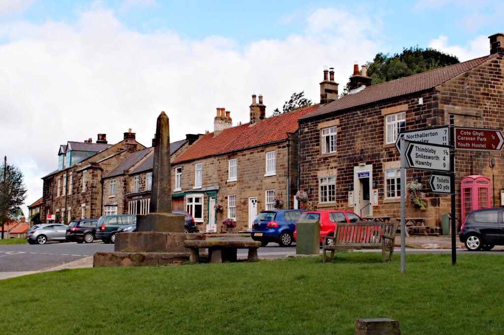 Village centre of Osmotherley with stone monument