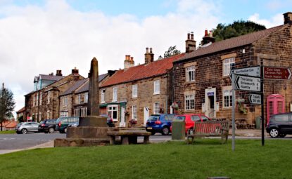 Village centre of Osmotherley with stone monument